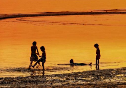 kids playing on beach in koh samui