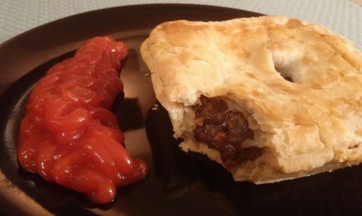  Filled with mincemeat and gravy, accompanied with a rich tomato sauce, the Australian meat pie is hand-sized and packed with delicious flavors. 