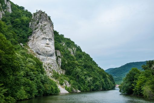 river with a stone structure of King Decebal, rock sculpture in Romania